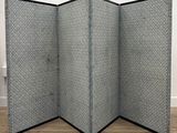 a black and white photo of a room divider in a room
