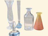 three different types of glass vases on the table