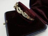 a ring that is in a velvet case on a table