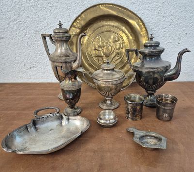 a lot of silver items sitting on a table