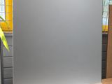 a mirror that is sitting on the floor in front of a window