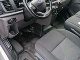 the interior of a car with a steering wheel, dashboard, and dashboard controls