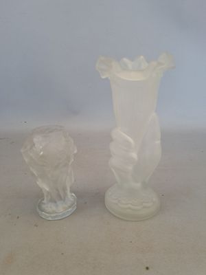 two vases that are sitting on a table