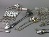 a lot of spoons and spoon spoons on the table