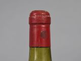 a bottle of wine that is sitting on a table