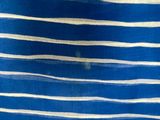 a close up of a blue and white striped fabric