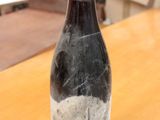 a bottle of wine that is sitting on a table