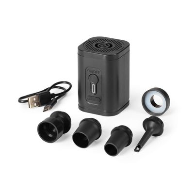a close up of a small black device with ear buds and a charger