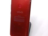 the back of a red cell phone with a display on it