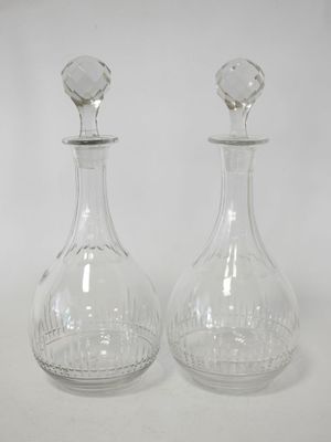 pair of clear glass decanters on a white background
