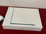 a white box with a charger on top of it