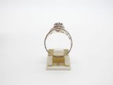 a close up of a ring on a stand with a white background