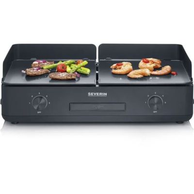 an image of a grill with meat and vegetables on it