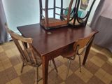 a wooden table with a mirror on top of it