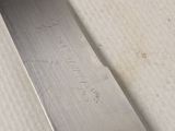 a close up of a knife on a table