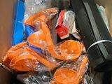 a cardboard box filled with items that include a laptop and other items