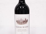 a bottle of wine that is sitting on a table