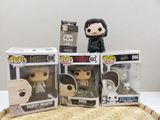 three game of thrones pop vinyl figures sitting on top of a wicker tray
