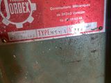 a red label on the side of a machine