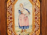 painting of a woman holding a cat in a wooden frame