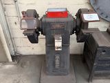 a machine that is sitting on the ground next to a wall