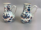 pair of blue and white vases with floral designs on them
