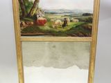 a person holding a mirror with a painting on it
