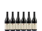 six bottles of wine are lined up on a white surface