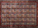an antique persian rug with a blue and red design