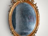 a mirror hanging on the wall in a room