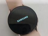 a smart watch with the samsung logo displayed on it