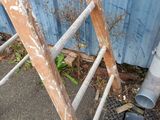 a ladder that is leaning against a building