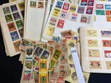 many different types of stamps on the pages of a book