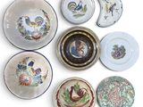 many plates with different designs on them on a white surface