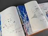 a book with a drawing of a man in a top hat