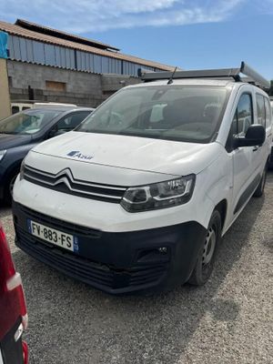 the white van is parked in the parking lot next to other cars