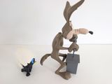 toy figurine of a rabbit with a briefcase and a black cat