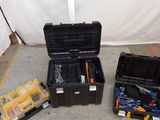 many tools in the case on the floor next to each other