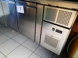two stainless steel refrigerators in a kitchen next to each other