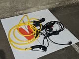 yellow and black hoses are on the ground next to a yellow and black hose