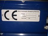 a picture of a sign on a machine that says semi automatic straping machine