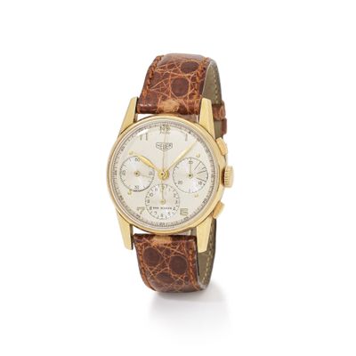 a close up of a watch on a white background