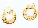 two pairs of gold hoop earrings on a white background