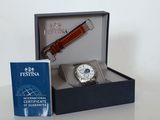 a box with a watch and a book on the table