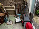 a lawn mower that is parked in a garage