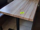 a table and two chairs in the corner of a room