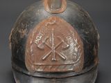 an old helmet with a cross on the front and a cross on the back