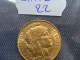a close up of a gold coin with a label on it