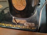 a close up of a sewing machine on a table