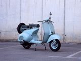 a scooter that is parked in a parking lot